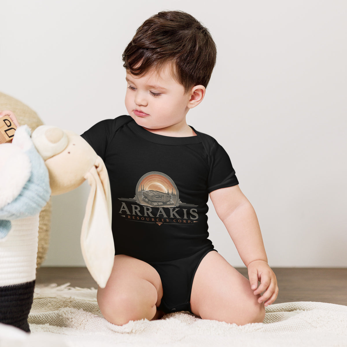 Baby bodysuit with a fictional mining company logo for Arrakis Resources Corp