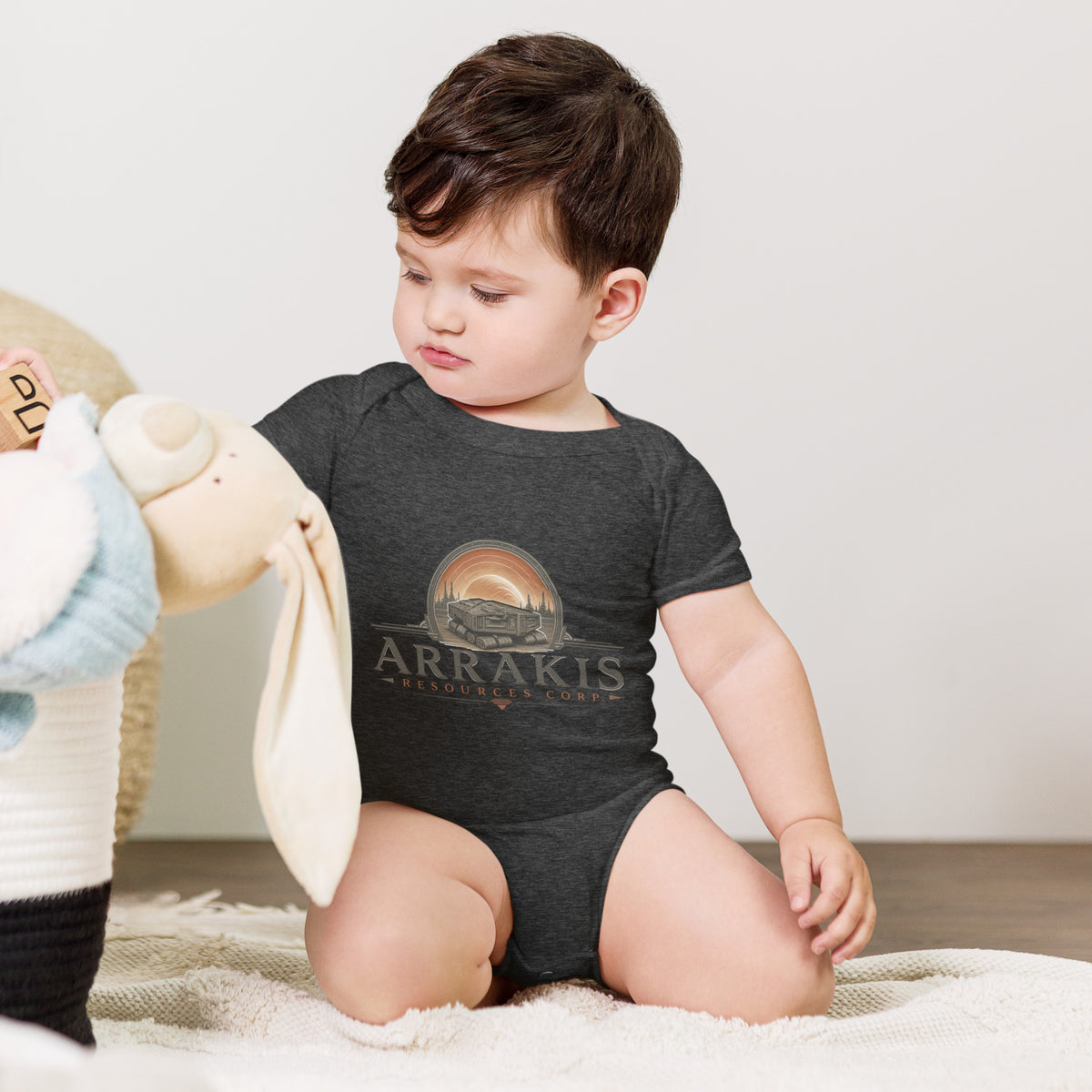 Baby bodysuit with a fictional mining company logo for Arrakis Resources Corp