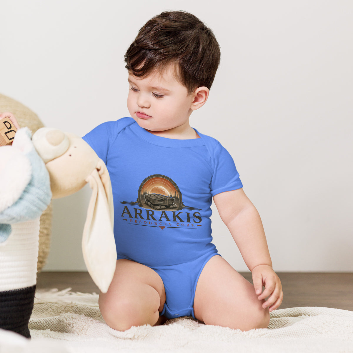 Baby bodysuit with a fictional mining company logo for Arrakis Resources Corp