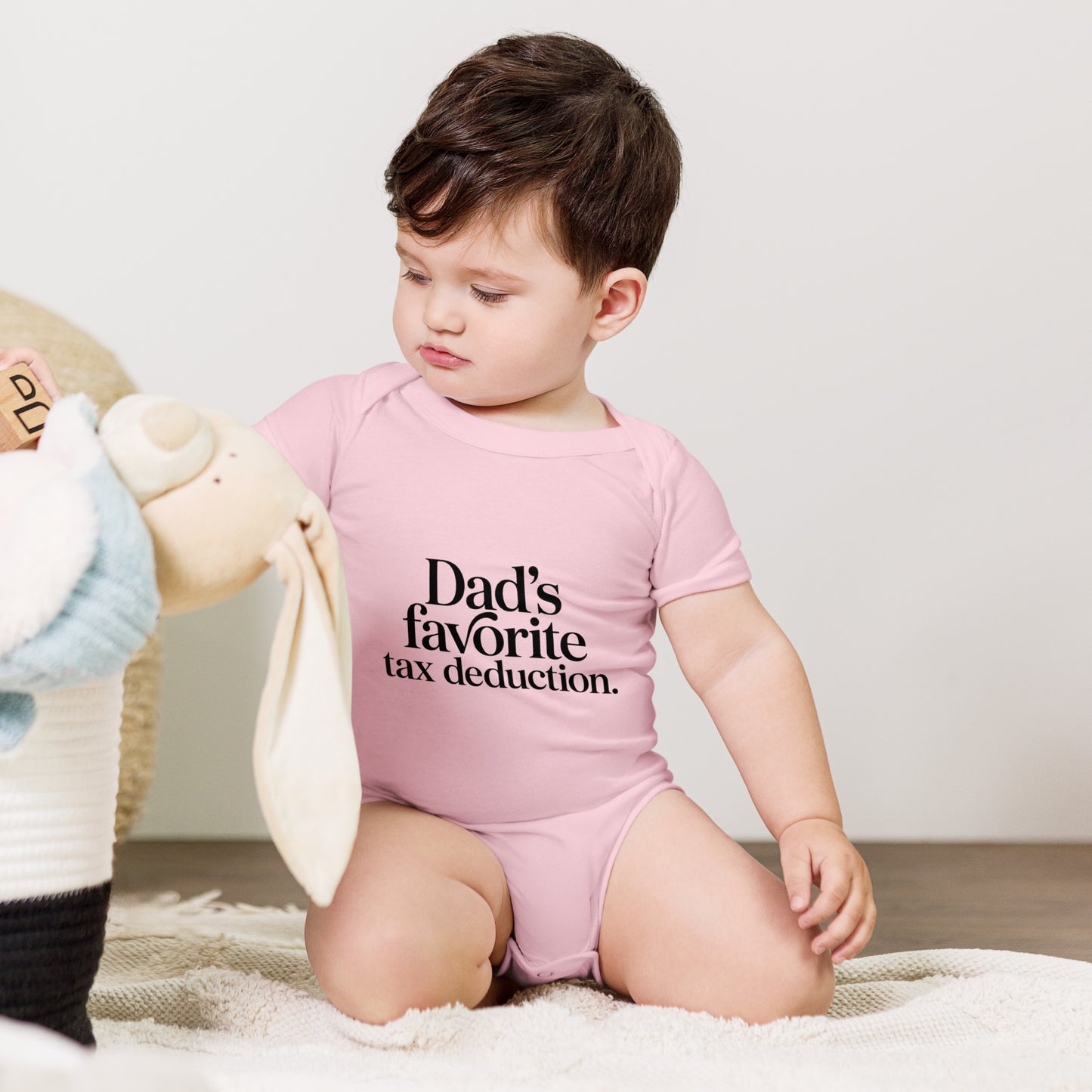 Baby bodysuit with the words Dad's favorite tax deduction