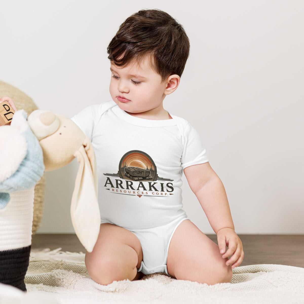 Baby bodysuit with a fictional mining company logo for Arrakis Resources Corp